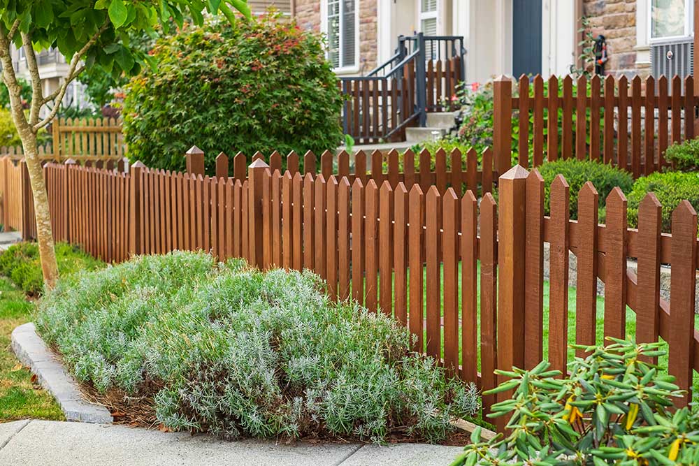 Nice wooden fence around house.