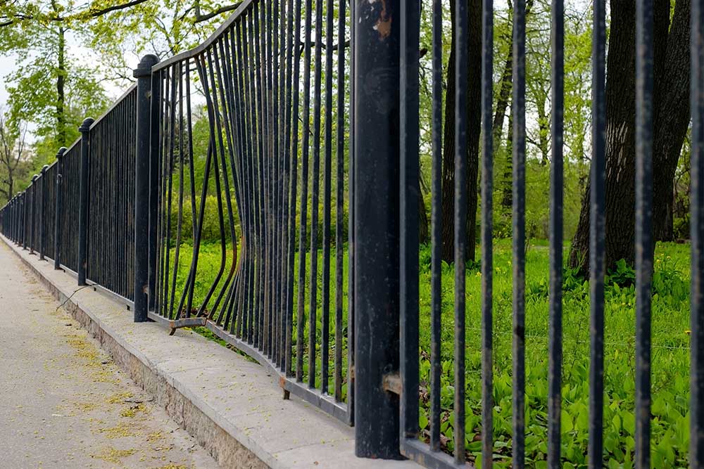 The bent fence after the accident.