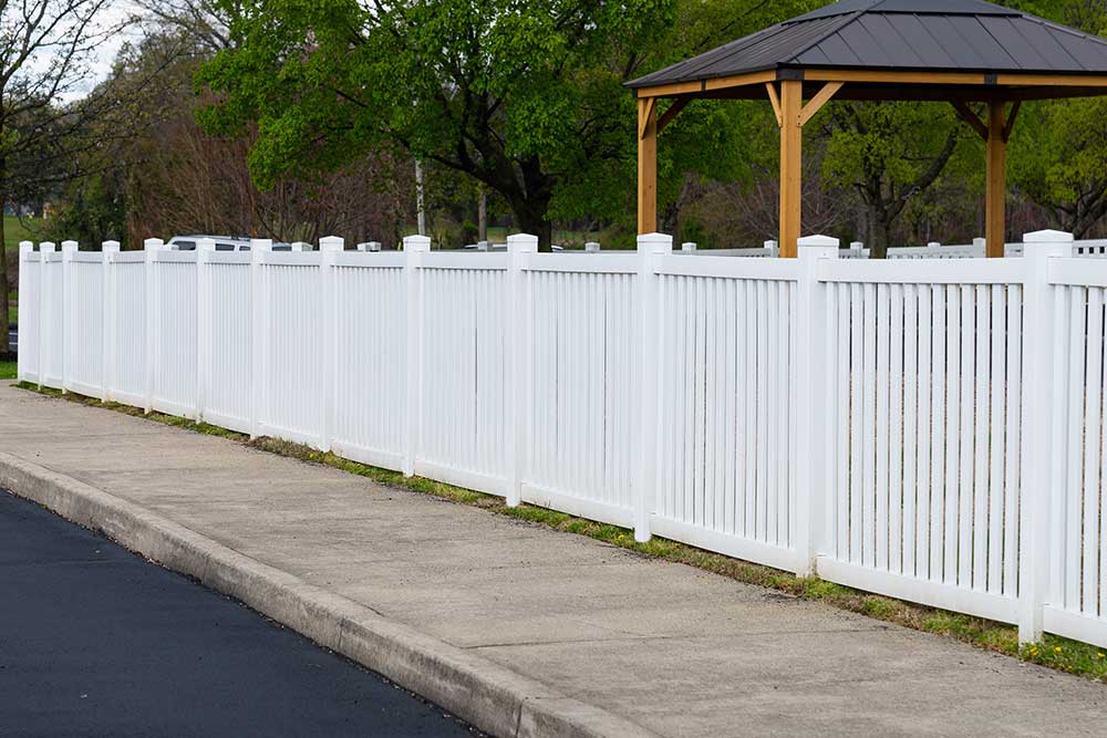 White vinyl fence fencing of private property