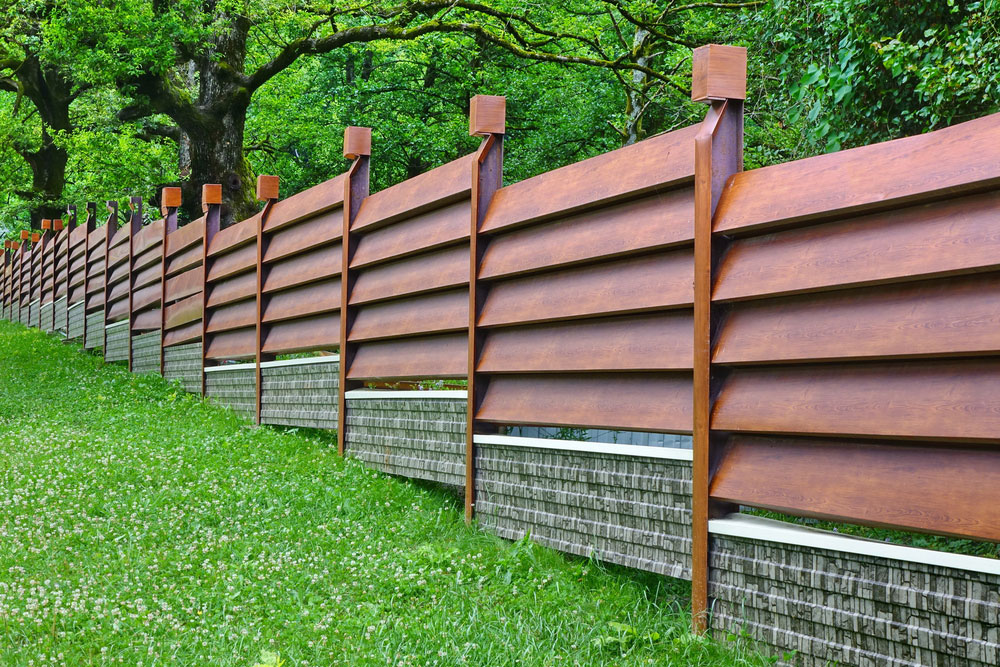 A Step-By-Step Guide To Installing A Backyard Fence On A Slope